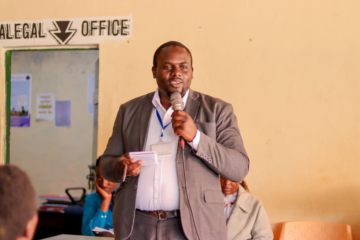 Community legal outreach session with a speaker addressing participants